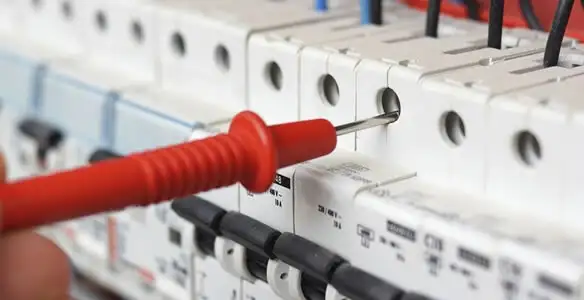 Electrical contractor testing circuit breakers during electrical repair in Winter Haven, FL