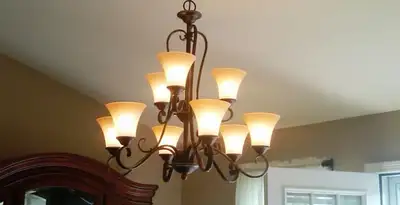 Classic ceiling chandelier installation with warm lighting in Lakeland, FL