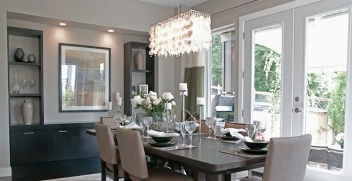 Elegant dining room chandelier installation above table in Lakeland, FL