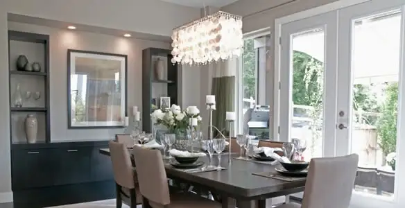 Elegant dining room chandelier installation above table in Lakeland, FL