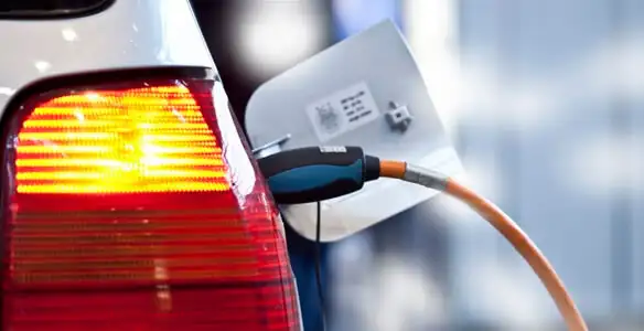 Electric car plugged into EV charger after professional installation in Lakeland, FL
