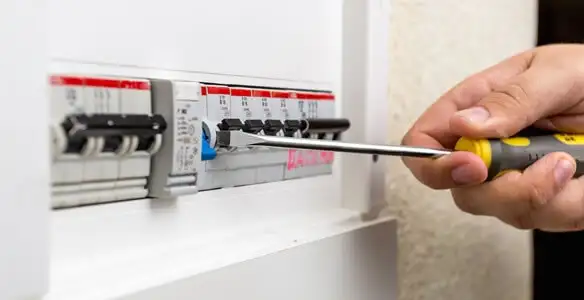 electrical panel upgrade service showing technician adjusting circuit breakers during system upgrade in Lakeland, FL