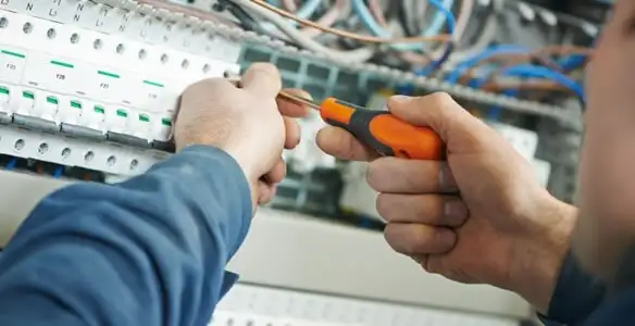 electrical service showing licensed electrician performing electrical panel maintenance and adjustments in Lakeland, FL
