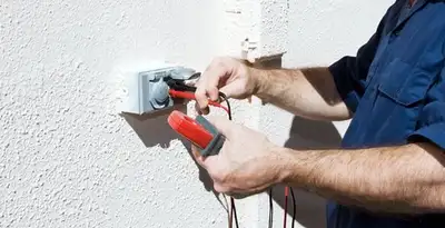 Electrician performing home electrical outlet and wiring inspection in Lakeland, FL