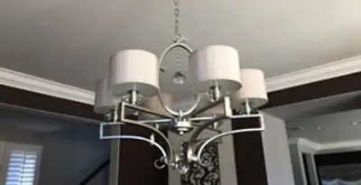 Modern chandelier installation with multiple light fixtures in Lakeland, FL