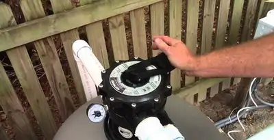 pool pumps service showing professional adjustment of pool pump control system in Lakeland, FL