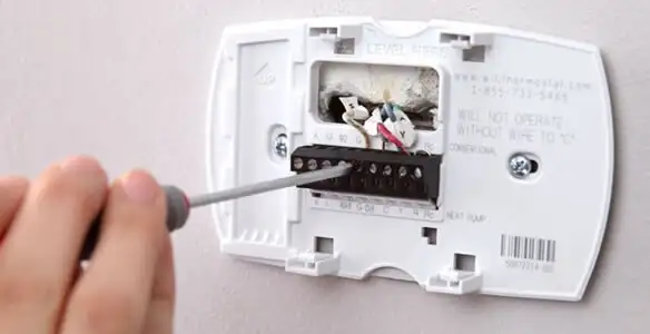 Thermostat installation service with proper wiring and secure wall mounting in Lakeland, FL